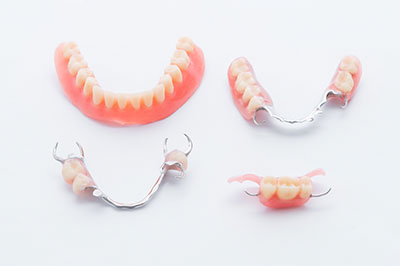 The image displays a collection of dental braces, showcasing various designs and styles.