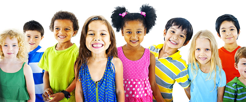 A group of diverse children posing for a photo with smiles.