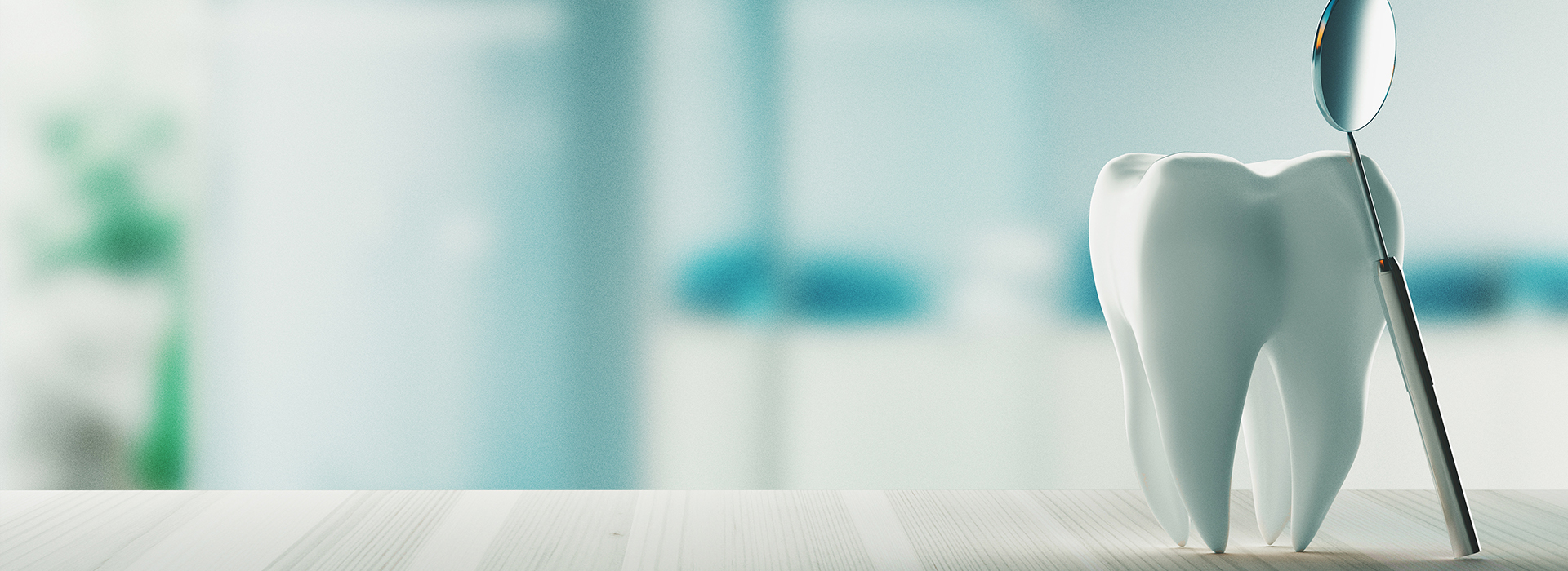 The image features a toothbrush with bristles and a handle, placed on a countertop in front of a blurred background that suggests a domestic setting.