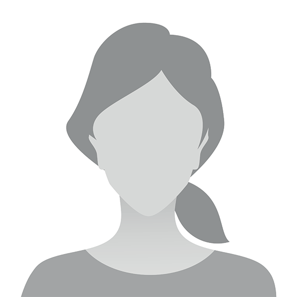 The image is a profile picture of a person with a neutral expression and dark hair, wearing a light-colored top.
